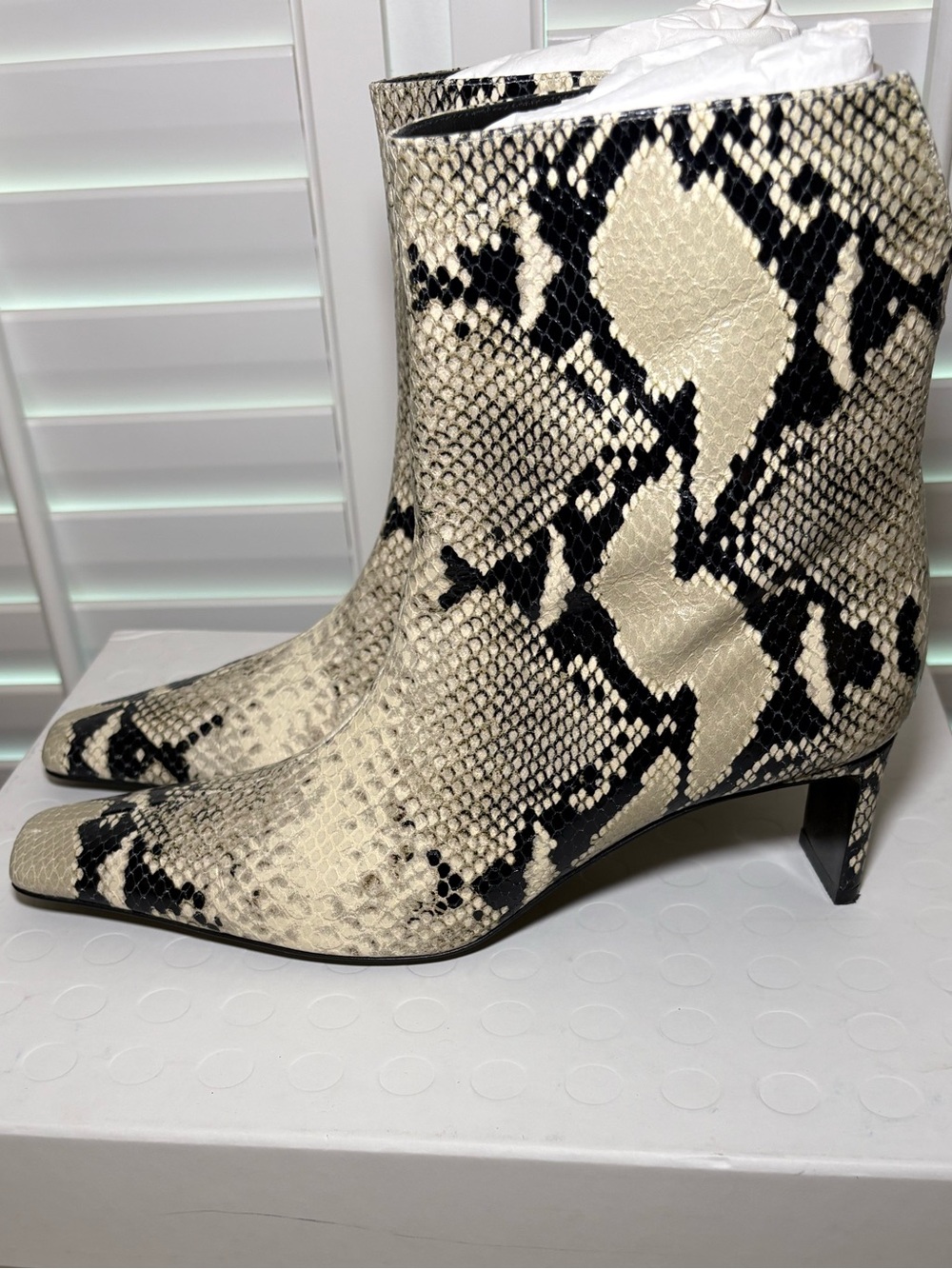 KHAITE Ona Ivory and Black Snake-Print Ankle Boots